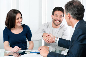 Happy couple meeting shaking hands with their bankruptcy trustee