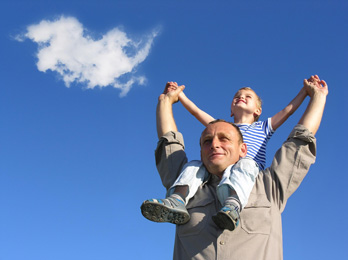 Father and son enjoying the freedom of being debt free