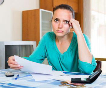 Woman Worried About Her Debts Woman worried about her debts