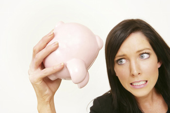 A woman with nothing in her piggy bank